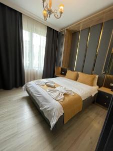 Postel nebo postele na pokoji v ubytování New Taksim Hotel