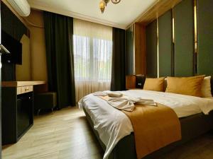 Postel nebo postele na pokoji v ubytování New Taksim Hotel
