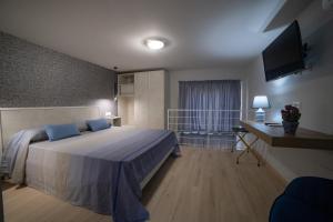 Katil atau katil-katil dalam bilik di Tropea City Home