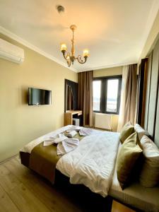Postel nebo postele na pokoji v ubytování New Taksim Hotel