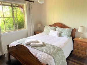 Llit o llits en una habitació de Bilyana Cottages