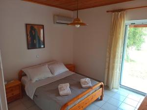 Postel nebo postele na pokoji v ubytování Alykesbeachhouse