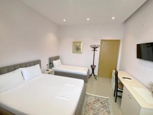 Postel nebo postele na pokoji v ubytování Guesthouse Niko