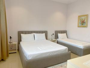 Postel nebo postele na pokoji v ubytování Guesthouse Niko