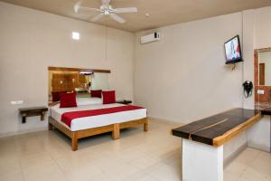 Auto Hotel Paraíso Inn tesisinde bir odada yatak veya yataklar