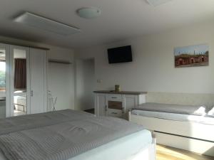 Posteľ alebo postele v izbe v ubytovaní Apartmány 27