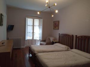 Postel nebo postele na pokoji v ubytování Hotel Ormazabal