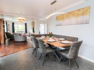 a dining room and living room with a table and chairs at Ashlea in Launceston