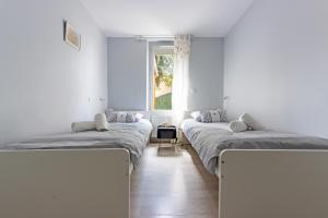 Ένα ή περισσότερα κρεβάτια σε δωμάτιο στο Le beau T3 de St Jory climatisation