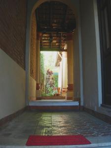 an entrance to a building with a red rug at Panambi in Asuncion