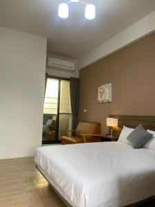 Voodi või voodid majutusasutuse 屏東潮州民宿-綠品文旅Green Inn toas