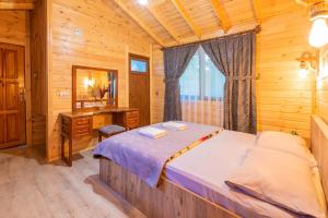 a bedroom with a bed and a desk and a mirror at Sheriff, Olympos in Kumluca +37 photos
