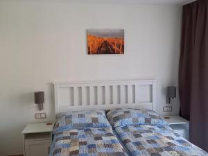 Posteľ alebo postele v izbe v ubytovaní Apartmány 27