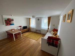 a living room with a couch and a table at Krakovska apartments in Ljubljana