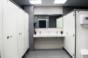 a bathroom with two sinks and a large mirror at Quart Youth Hostel & Apartments in Valencia