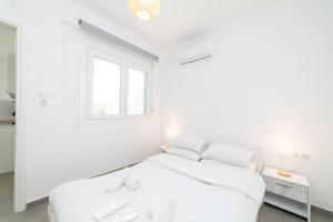 Postel nebo postele na pokoji v ubytování Kleoniki & Irida Residential Complexes