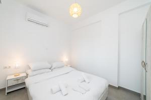 Postel nebo postele na pokoji v ubytování Kleoniki & Irida Residential Complexes