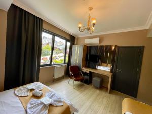 TV a/nebo společenská místnost v ubytování New Taksim Hotel