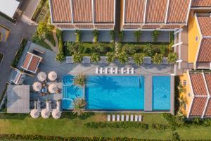 an overhead view of a swimming pool at a resort at BAY RESORT HOI AN in Hoi An