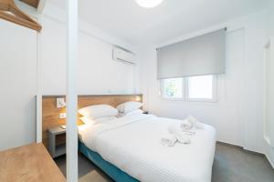 Säng eller sängar i ett rum på Kleoniki & Irida Residential Complexes