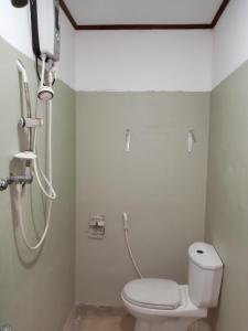a bathroom with a shower with a toilet in it at Rock house in Hiriketiya +29 photos