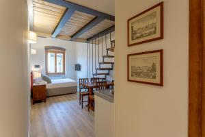 a living room with a kitchen and a dining room at Ramaglianti Apartments Suite Tre in Florence