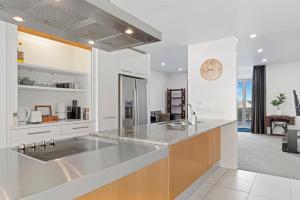 a kitchen with a sink and a counter top at Lakeview Luxury - Taupo Holiday Apartment in Taupo