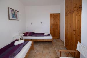Postel nebo postele na pokoji v ubytování Bungalow Musuri