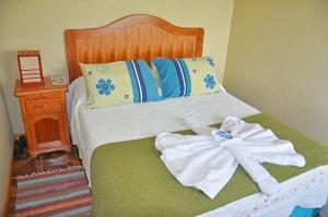 Łóżko lub łóżka w pokoju w obiekcie Hotel Tekarera - Kainga Nui