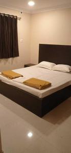 Lova arba lovos apgyvendinimo įstaigoje OYO Hotel Swagat Inn