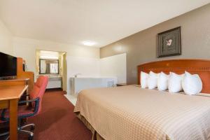 Ένα ή περισσότερα κρεβάτια σε δωμάτιο στο Days Inn by Wyndham Paintsville +19 φωτογραφίες