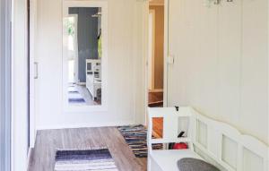 a living room with a staircase and a mirror at 5 Bedroom Amazing Home In Matre in Bauge