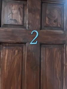 a wooden door with the number two on it at Quiet And Comfortable Deluxe in Anchorage