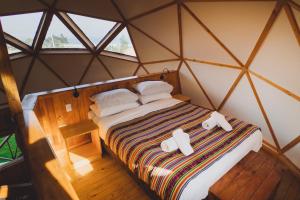 Tempat tidur dalam kamar di Pichilemu Domos +37 foto