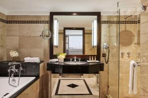 a bathroom with a sink and a tub and a shower at Hyatt Regency Casablanca in Casablanca