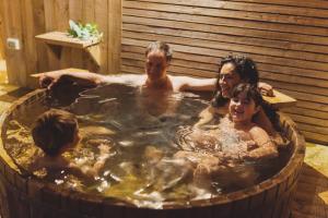 a group of people in a hot tub at Pichilemu Domos in Pichilemu