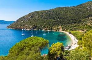a view of a beach with boats in the water at Amalthia Cottage in Vathi, Ithaka +7 photos