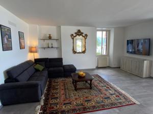 a living room with a couch and a table at Wonderful Stresa apartment in Stresa