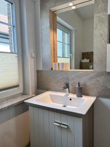Koupelna v ubytování Ostseehaus Dreesen + 37 fotografií