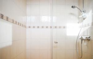 a bathroom with a shower with a glass door at Beautiful Home In Hovland With Kitchen in Hovland +22 photos