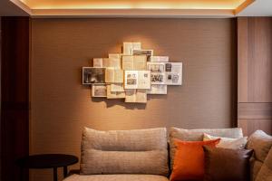 a living room with a couch and a wall at THE BASICS FUKUOKA in Fukuoka +124 photos