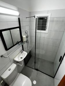 a bathroom with a shower and a toilet and a sink at דירת 4 חדרים מול הים in Bat Yam