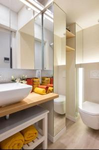 a bathroom with a sink and a toilet at II-II Hub Luxury New Apartments in Barcelona