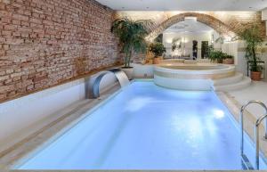 Cama ou camas em um quarto em NARUTIS Hotel - Small Luxury Hotels of The World