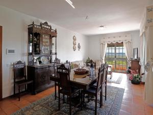 a dining room with a table and chairs at Quinta Soutelinho in Sabrosa