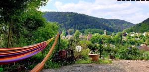 a hammock in a garden with a view of a mountain at Miky Home in Calw