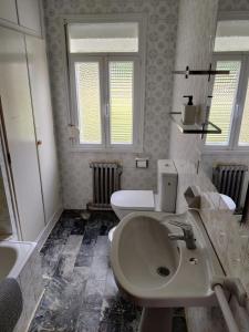 a bathroom with a sink and a toilet at Casa A Mariña in Barreiros