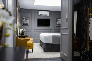 a hotel room with a bed and a television at No.4 Carlton in Southampton