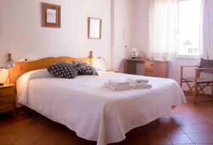 Grupoandria El Claustre de Ciutadella - HOSPEDERIA客房内的一张或多张床位