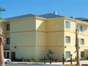 a large building with a view of the ocean at Days Inn by Wyndham North Mobile in Mobile